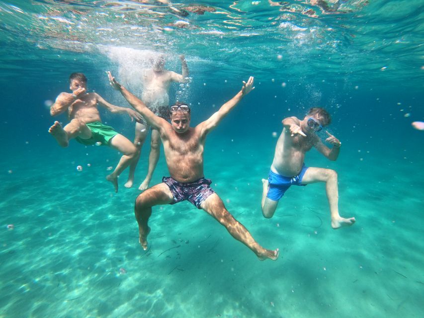 Athens: Catamaran Cruise with Fresh Lunch and Wine - Vouliagmeni Bay: another swim with a more cosmopolitan shoreline