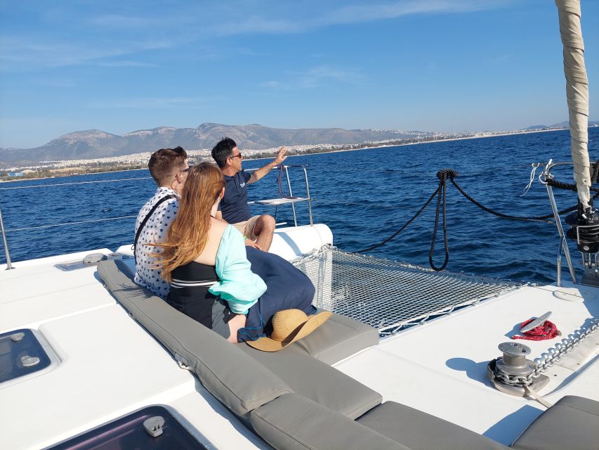 Athens: Catamaran Cruise with Fresh Lunch and Wine - Wine, fruit, and a quiet sail back toward Alimos