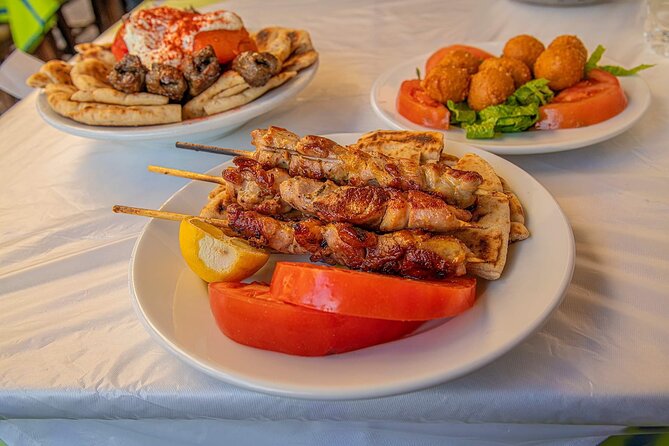 Feast on Athens: LGBTQ+ Walking Food Tour - Back to Monastiraki Lunch: Family Style Choices and Loukoumades