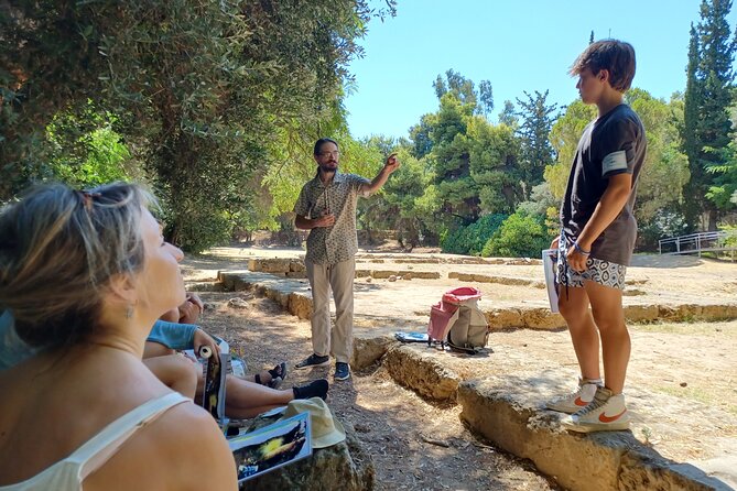 Philosophy Experiential Workshop at Plato's Academy Park -Athens - Role-play debate with a water-timer replica, like the ancient agora